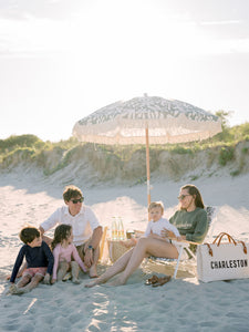 Family sitting on the beach Sullivan's Island